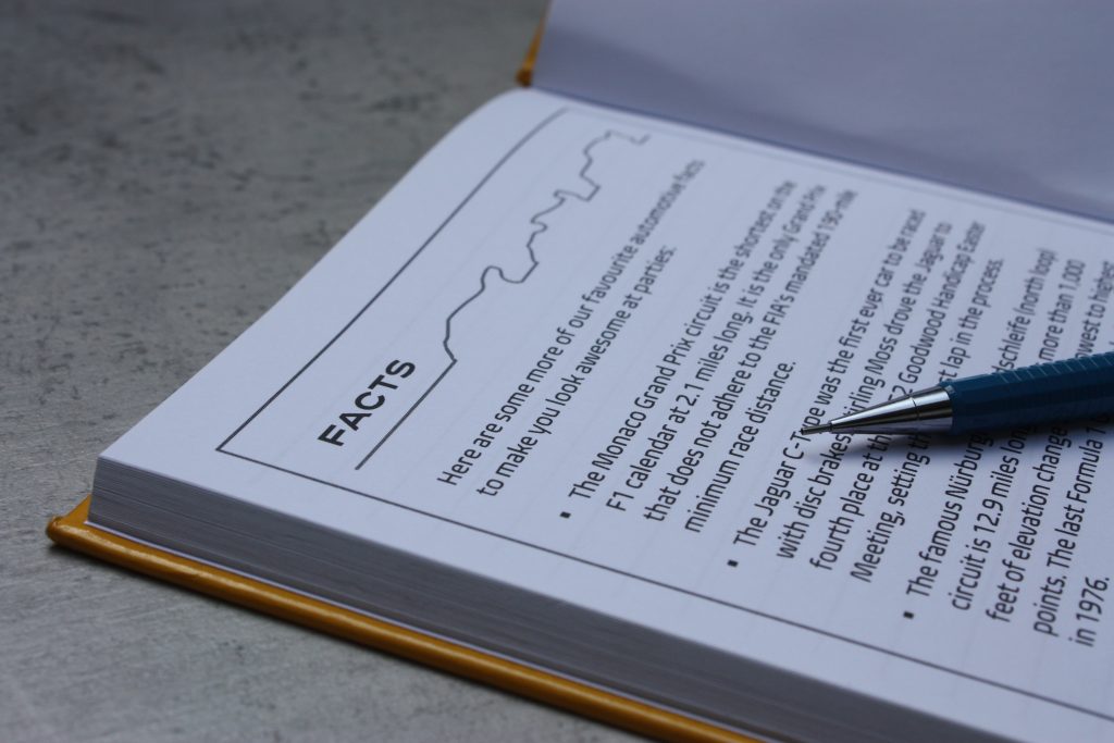 The interior of a jotter pad, with car facts printed on the inside cover.