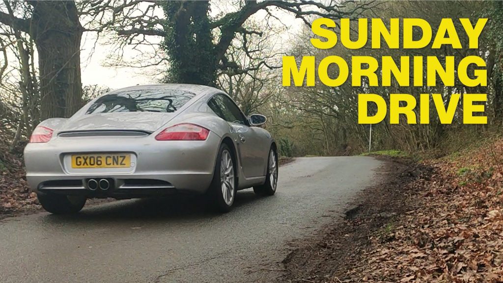 A YouTube video thumbnail featuring a Porsche Cayman driving on a country road.